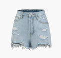 a pair of blue denim shorts with ripped knees
