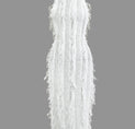 a white dress with feathers on it