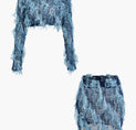 a pair of blue denim shorts with fringes