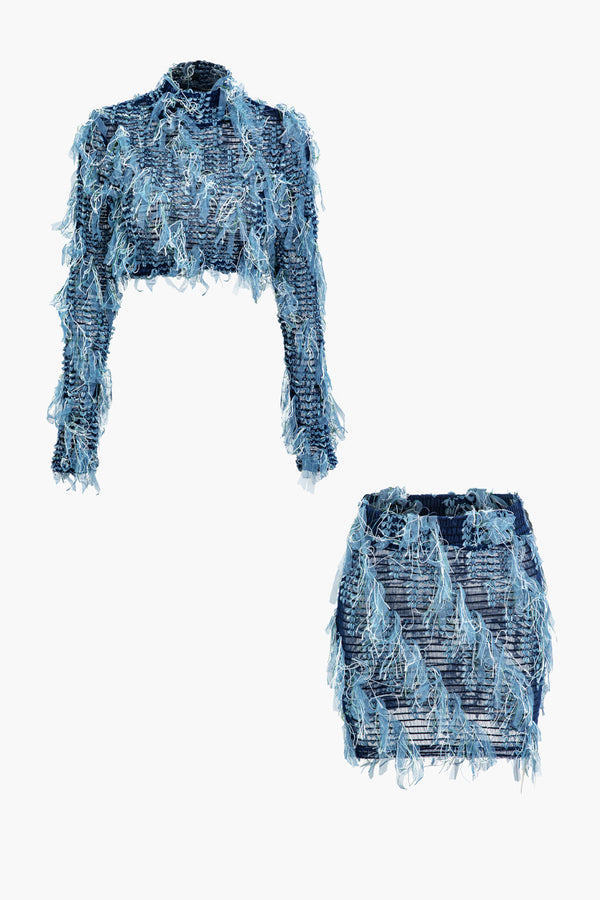a pair of blue denim shorts with fringes