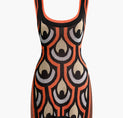 a black and orange dress with a pattern on it