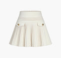 a white plea skirt with buttons and buttons
