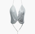 a silver bikini top on a white background