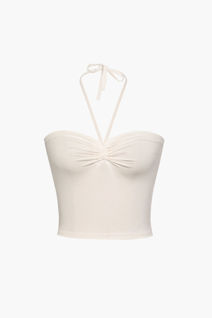 a white top with a bow on the front