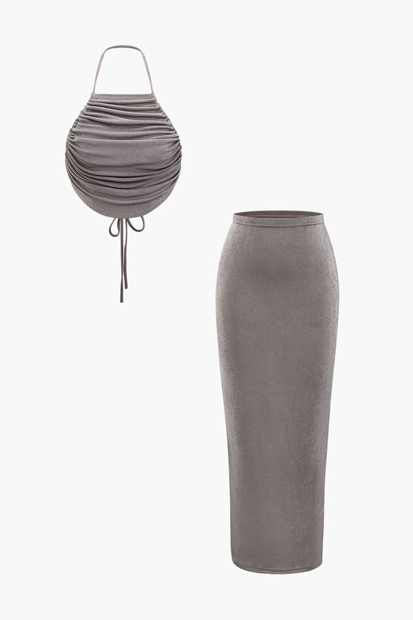 a grey skirt and a white top