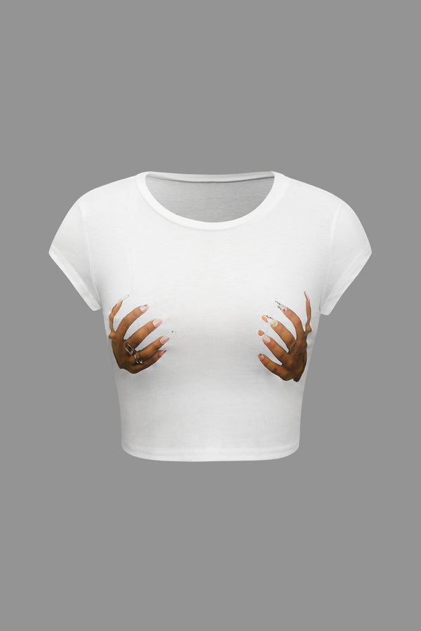 a white crop top with two hands on it