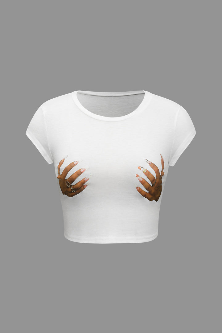 a white crop top with two hands on it
