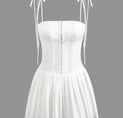 a white corset with straps and a white corset