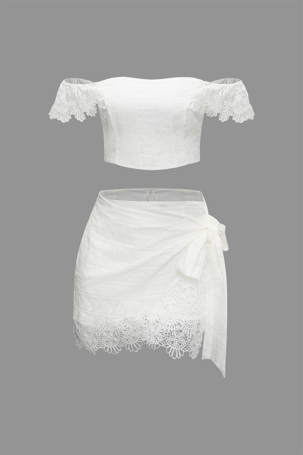 a white top and skirt with lace detailing