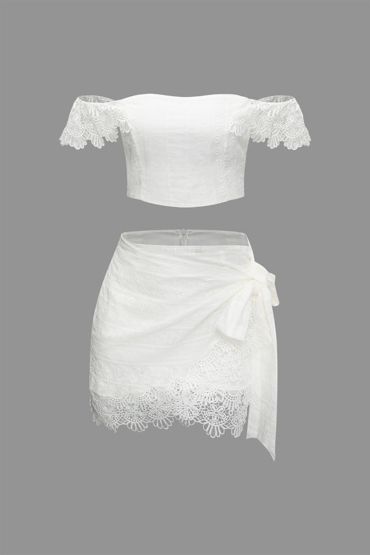 a white top and skirt with lace detailing