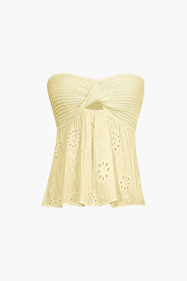 a yellow top with a bow on the front