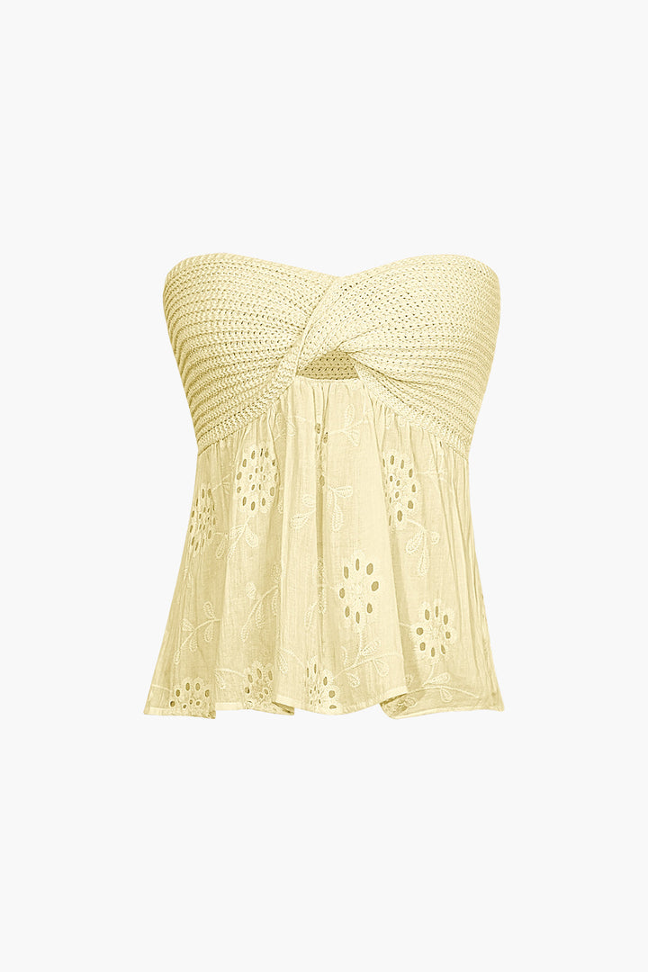 a yellow top with a bow on the front
