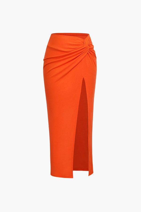 an orange pencil skirt with a side slit