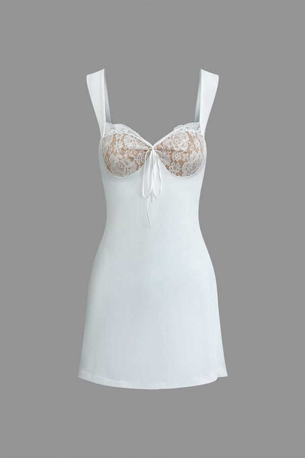 a white dress with lace on the front