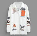 a white jacket with orange and black logos on it