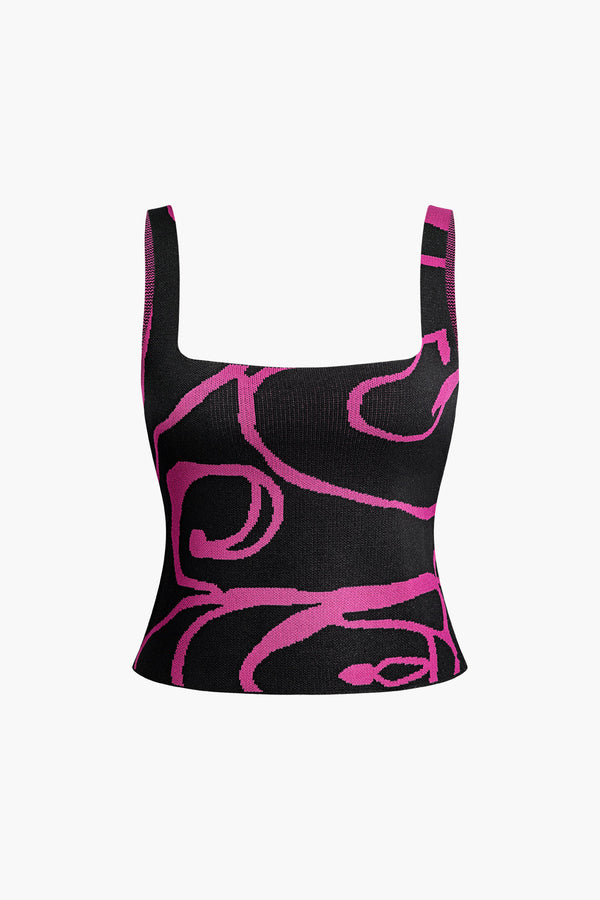 a black and pink crop top with pink swirl print