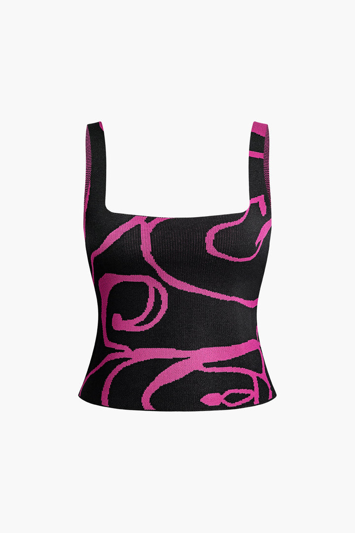 a black and pink crop top with pink swirl print
