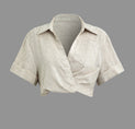 a white shirt with an open collar and short sleeves