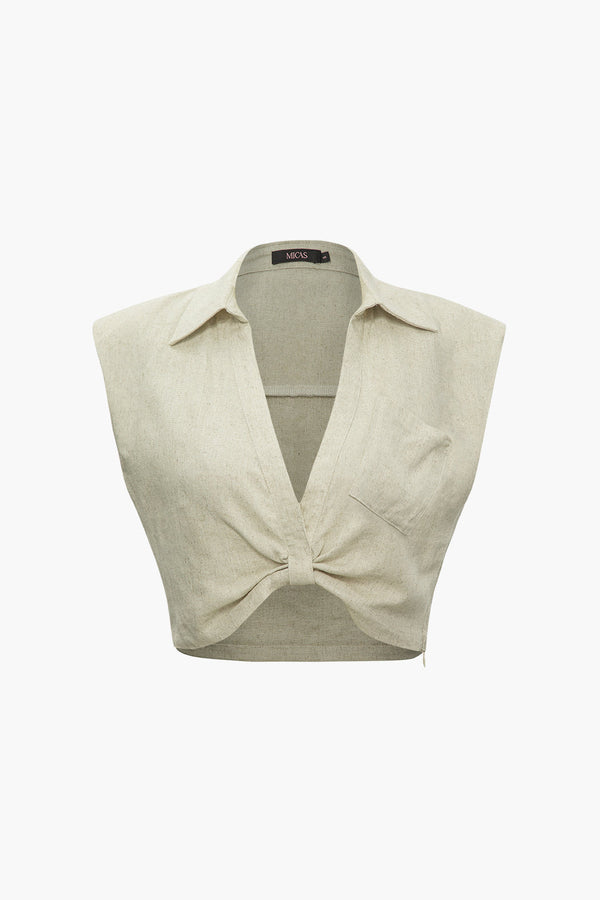 a white top with a bow on it