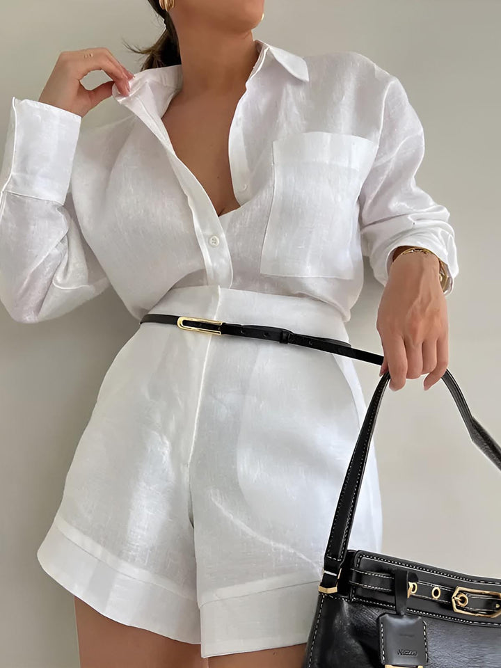 a woman wearing a white shirt and shorts