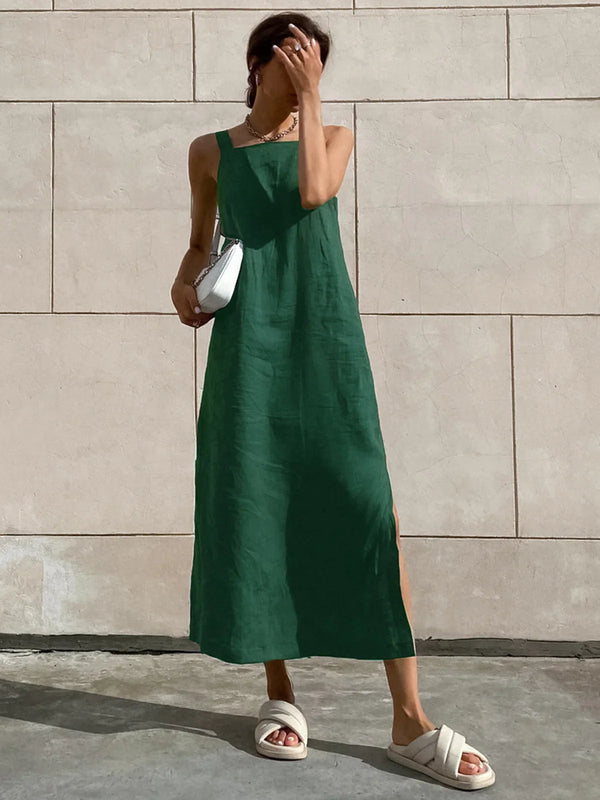 a woman wearing a green dress and white shoes