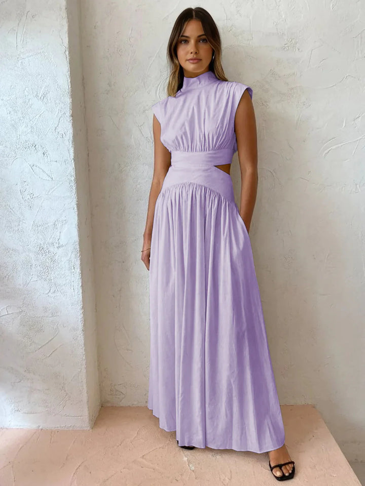a woman wearing a lavender colored dress