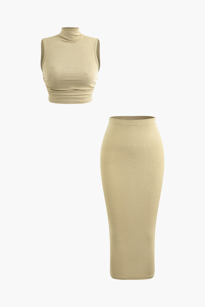 a woman in a beige top and skirt