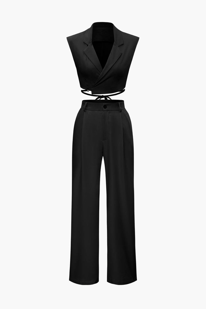 a black jumpsuit with a tie around the waist