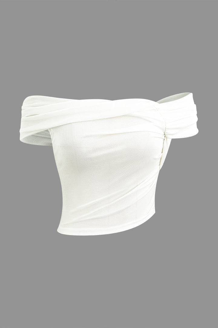 a white top with an off - the - shoulder design