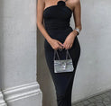 a woman wearing a black one shoulder dress