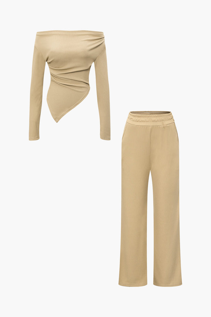 a woman is wearing a tan top and pants