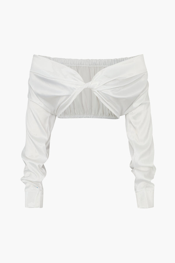 a white crop top with a bow at the front