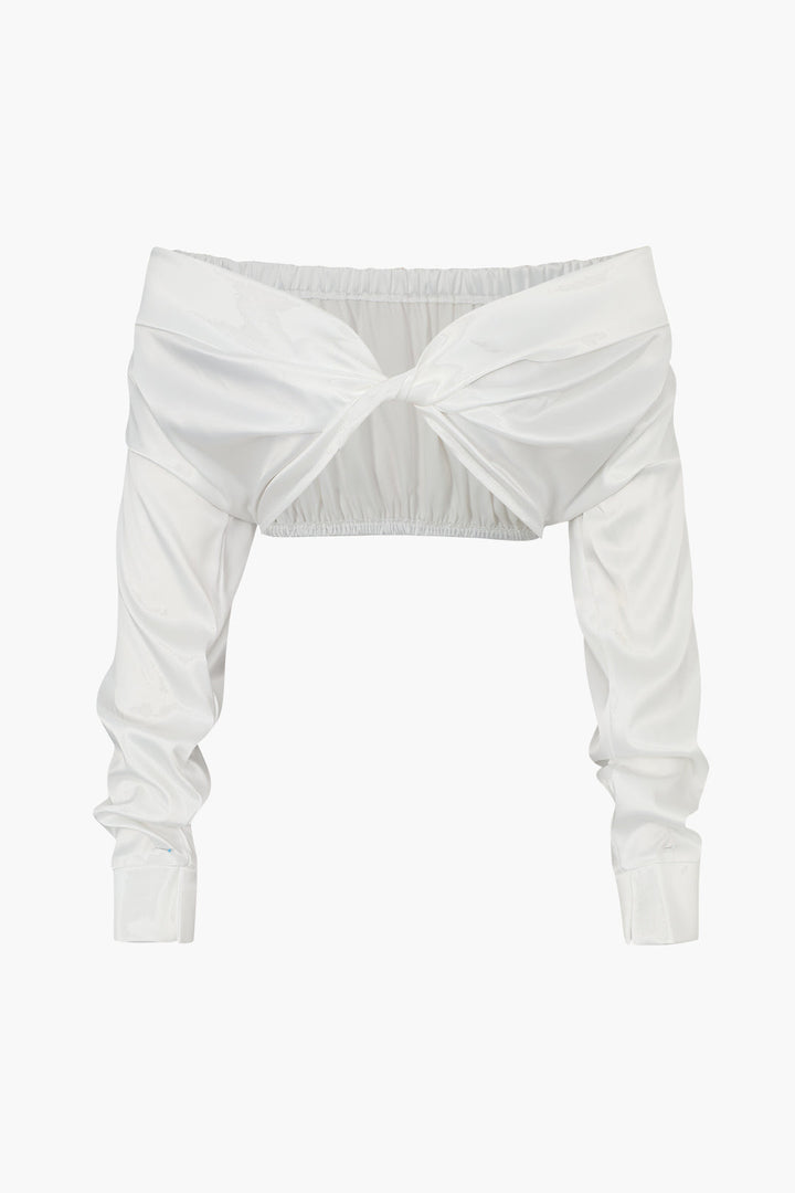 a white crop top with a bow at the front