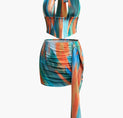 a multi - colored swimsuit with a halt neck