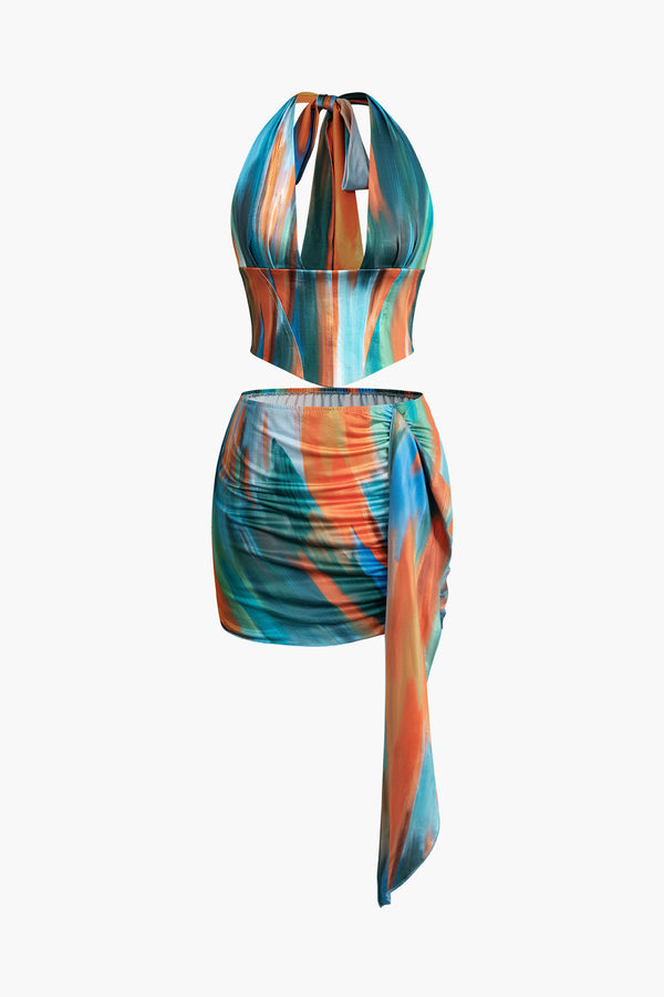 a multi - colored swimsuit with a halt neck