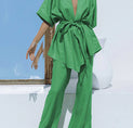 a woman in a green jumpsuit