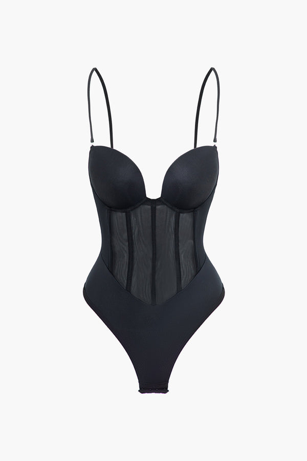 a woman in a black bodysuit