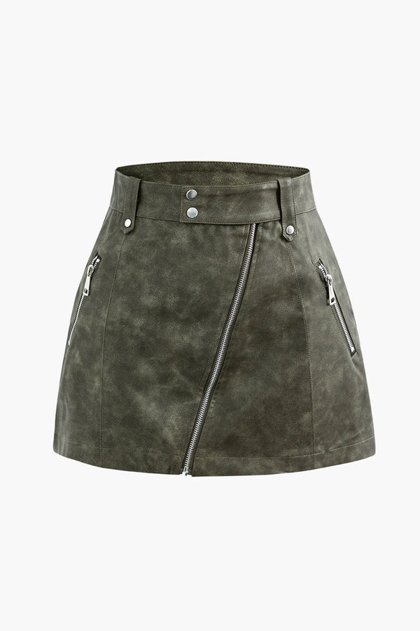 a green sued skirt with zippers and zippers