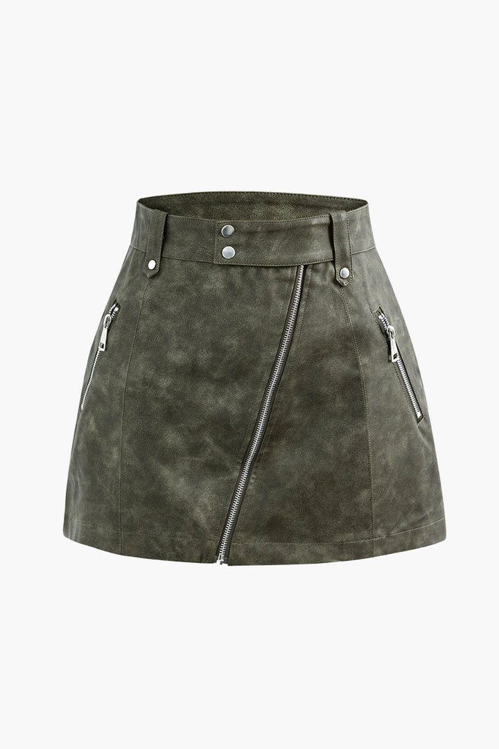 a green sued skirt with zippers and zippers