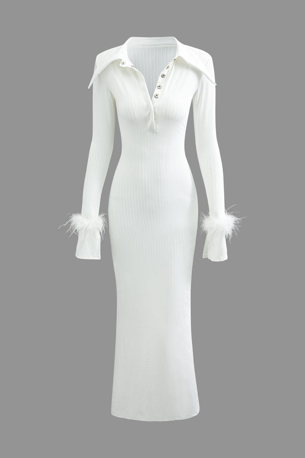 a white dress with feathers on the sleeves