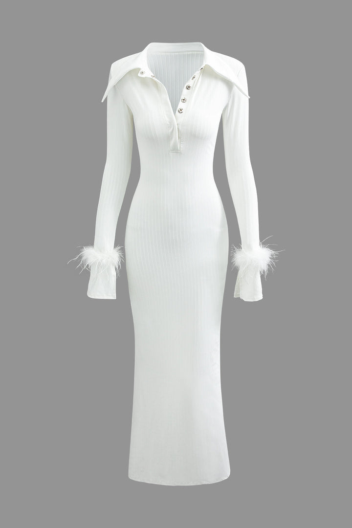 a white dress with feathers on the sleeves