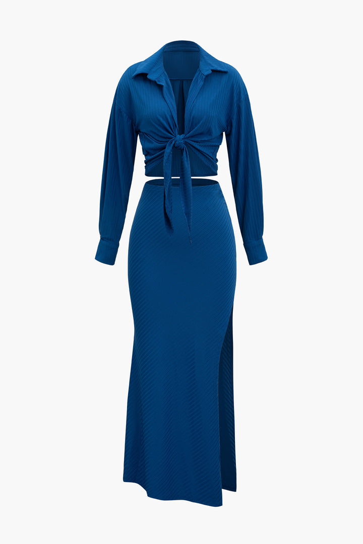 a woman wearing a blue dress with a tie around the waist