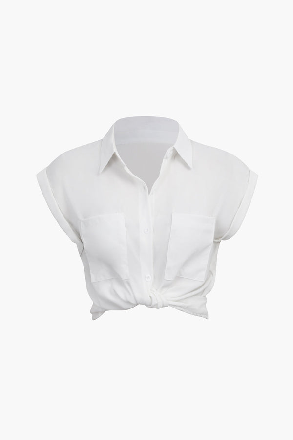 a white shirt with a bow on the front