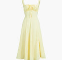 a yellow dress on a white background