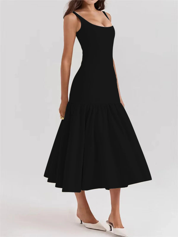 a woman wearing a black midi dress