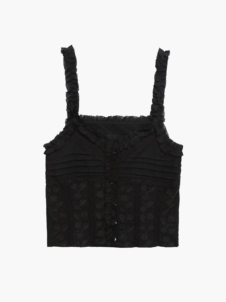 a black top with a floral pattern on the front