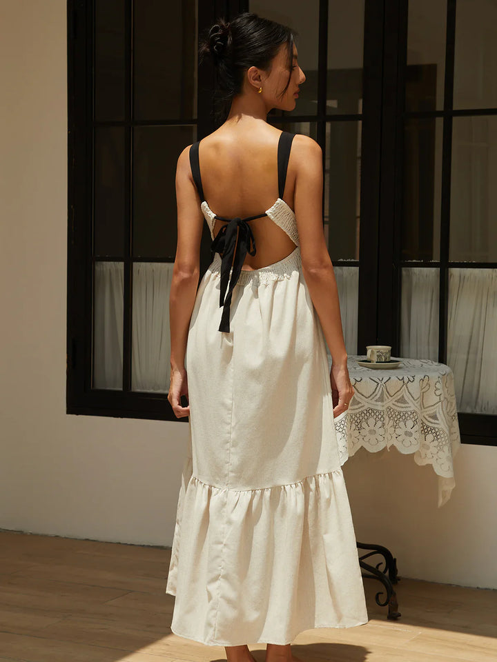 the back of a woman in a white dress