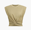 a beige crop top with a knot on the front