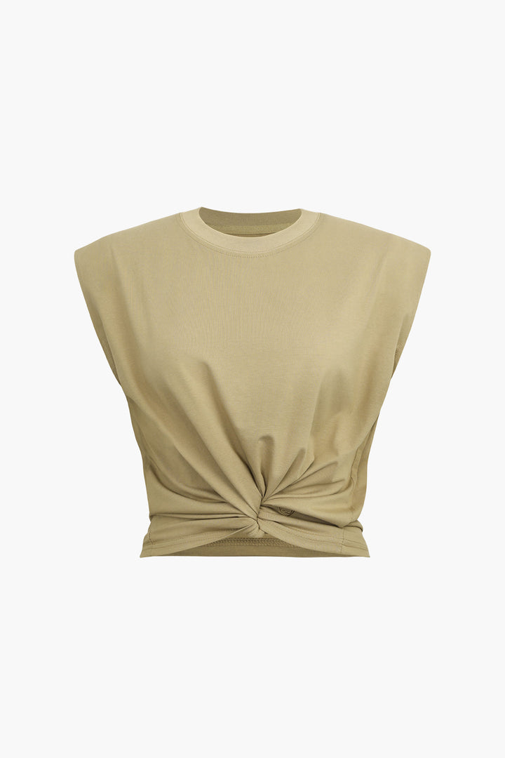 a beige crop top with a knot on the front