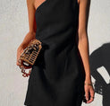 a woman wearing a black one shoulder dress